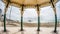 Fish eye view of the Victorian bandstand and the remains of the destroyed West pier in Brighton and Hove