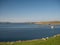 Fish farming on calm waters near Hamnavoe on the west of Mainland, Shetland, Scotland, UK - taken on a sunny day in August