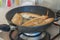 Fish fillet cooking on fry pan, food preparation