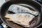 Fish with flour fried in cooking pan with hot oil