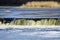 Fish jumps on waterfall Ventas rumba at Kuldiga city, Latvia