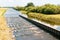 Fish ladder in the Sude, tributary of the Elbe near Boizenburg in nice summer weather