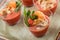 Fish mousse with shrimps and squids in glass cups on banquet table. Delicious appetizers, gourmet food close up, snack