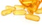 Fish oil capsules,yellow gold medicine capsule isolated on the white background,Drug medicine concept 3d rendering
