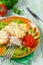 Fish pike perch with vegetables and cheese