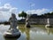 Fish pond in the park and three stone sculpture