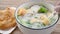 fish porridge with deep-fried Chinese donuts horizontal composition