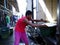 A fish port and market worker loads fresh fish to a truck