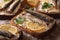 fish sandwiches with sprats, cream cheese and lemon macro. horizontal