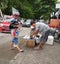 A fish seller on the roadside is serving a customer