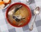 Fish soup with salmon bones and vegetables