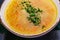 Fish soup with salmon, sea bass, vegetables in a bowl