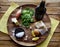 Fish, spinach and egg salad on a dark background, top view. Delicious healthy food concept