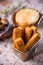 Fish sticks in a metal basket and spanish omelet