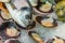 Fish still life. Dorado head, mussels in shells on ice. Top view. Close up