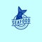 Fish tail logo. Seafood restaurant. Fish Tail and letters on a circle. Blue Label. Isolated on light background.