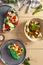 Fish and vegetables salads in ceramic plates top view