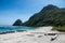 Fisher boats at the beach with jungle and mountains in the background near surf spot Tropicals on Sumbawa