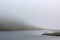 Fisher fishing in the Horntjerni lake river on VeslehÃ¸dn, Norway