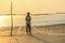 Fisher setting net on beach