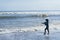 Fisher standing in the beach ,Bali