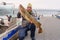 Fisherman with big cod fish. Norwegian fisherman has caught large Cod in Norwegian Fjord islands