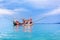 Fisherman boat on blue sea, sky, clouds landscape background close up, beautiful seascape with red wooden fishing vessel, Thailand