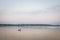 Fisherman boat fishing on the Danube river on his rowing boat during a warm autumn afternoon in Zemun