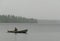 Fisherman boat fog rain