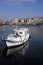 Fisherman boat and its reflection.