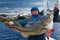 Fisherman on boat near Lofoten island