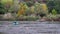 Fisherman in boat on river