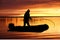 Fisherman on a boat at sunrise