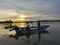 Fisherman on boat during sunset at Kampung Gayang