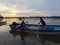 Fisherman on boat during sunset at Kampung Gayang