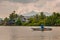 A Fisherman in the boat. A village by the river in Sarawak, Kuching, Malaysia