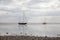 Fisherman boats stuck on the beach in low tide period.