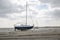 Fisherman boats stuck on the beach in low tide period.