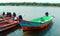 The fisherman boats waiting for the fisherman with ice box.