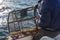 Fisherman bringing back lobster pot in a boat