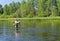 Fisherman catches of chub fly fishing in the Chusovaya river