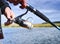 A fisherman catches a fish. Spinning reel closeup. Shallow depth of field on the spool of fishing line