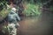 A fisherman catches spinning in the waders. Trout fishing