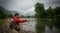 Fisherman catching trout on a river.