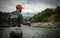 Fisherman catching trout on a river.