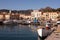 Fisherman Cleaning Fishnets At Porto Azzurro