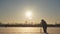 Fisherman drills a hole ice fishing