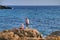 Fisherman in the evening on Isla Plana beach in Cartagena