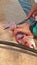 Fisherman filleting and skinning a red snapper