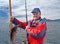 Fisherman with a fish on Lofoten island